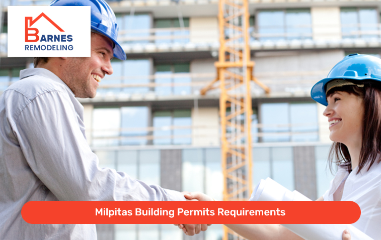 Two people shaking hands at a construction site with building permit documents in hand